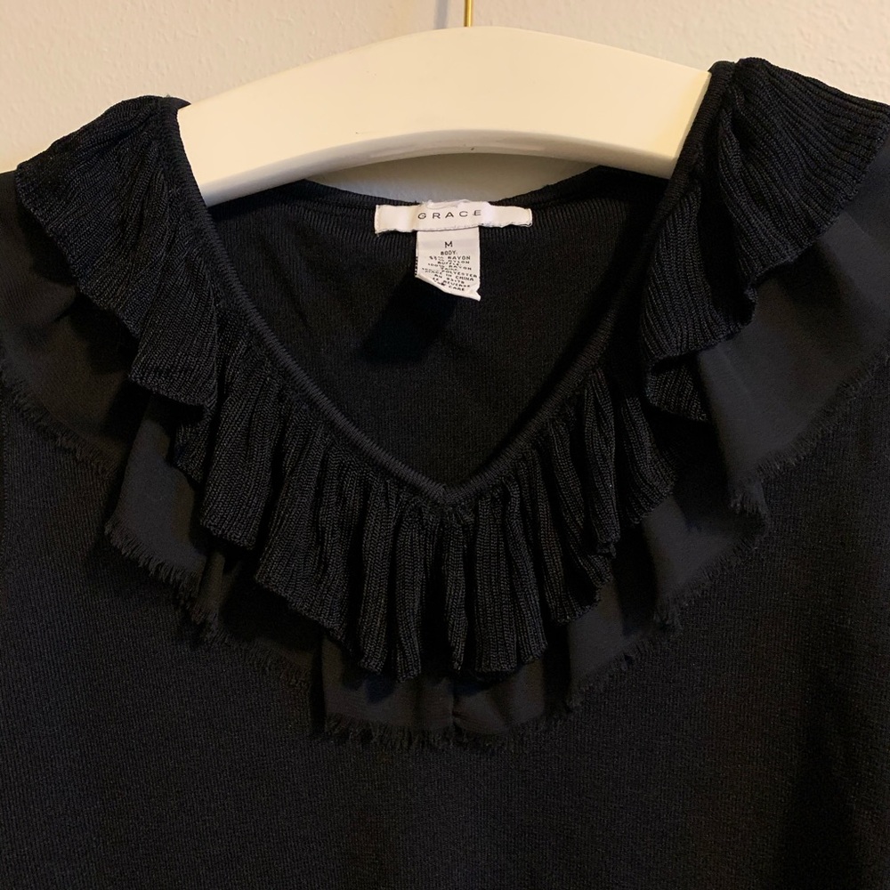 Black Grace knitted blouse lightly ruffled